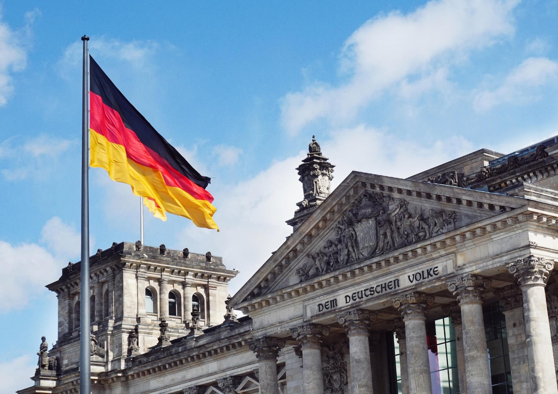 Flag of Germany infront of an old building